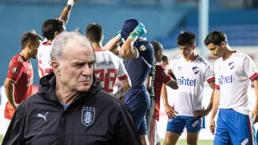 Marcelo Bielsa y los jugadores de Nacional lamentándose.